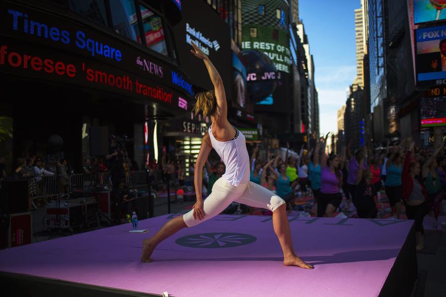 Thousands celebrate Summer Solstice with yoga in NY
