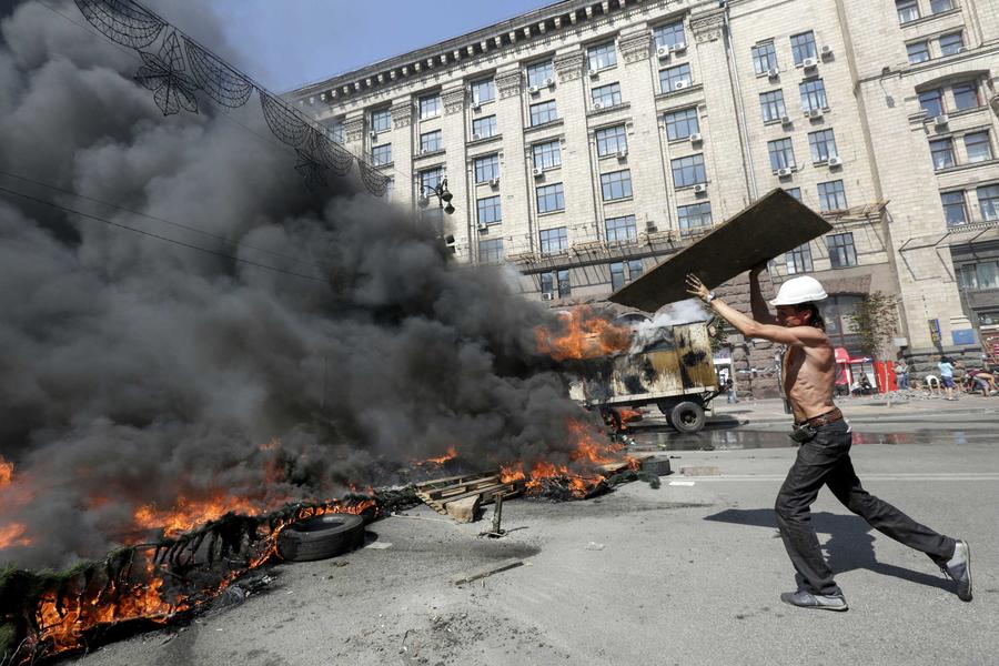 Smoke rises during clashes in Kiev
