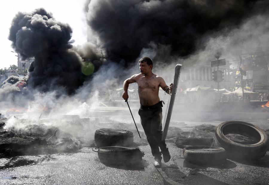 Smoke rises during clashes in Kiev