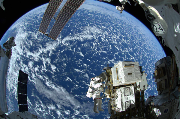 Astronauts venture outside station for spacewalk