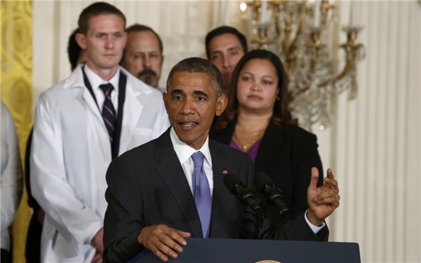 Obama praises Ebola fighters as 'heroes'