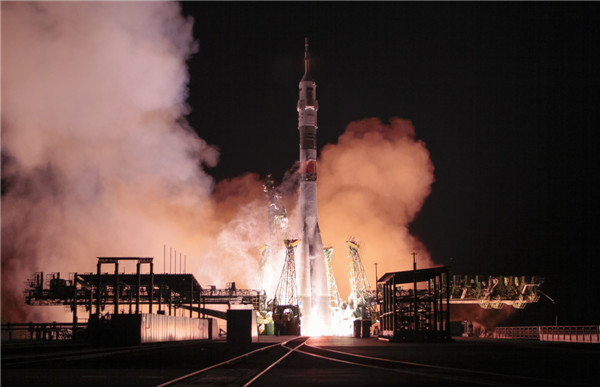 Multi-national crew blasts off for space station