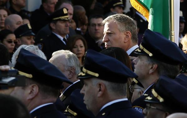 Angry police shun NYC mayor at funeral for slain officer