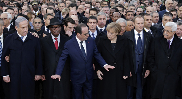 Leaders walk arm-in-arm as millions protest Paris attacks