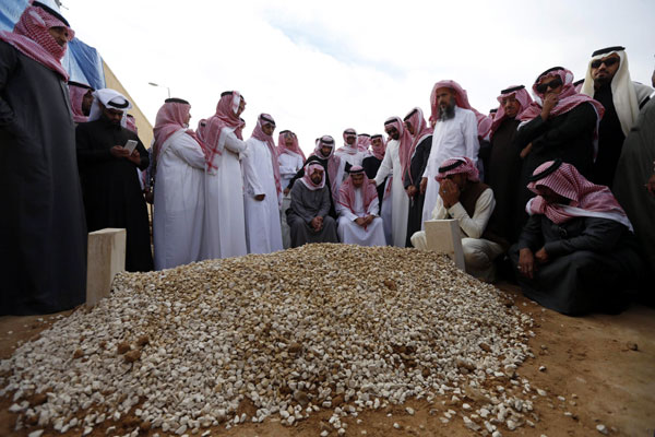 Saudi King Abdullah mourned in simple burial