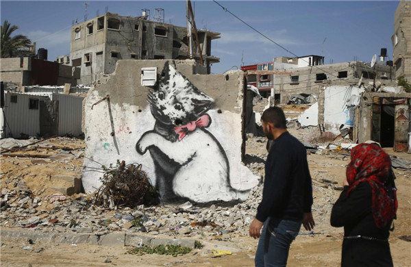 British street artist paints works in Gaza
