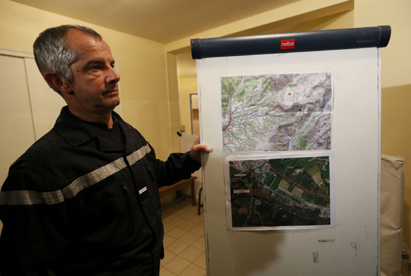 France cracks open plane's black box, seals off crash site