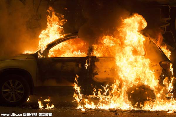 Greek anti-establishment protesters torch cars, clash with police
