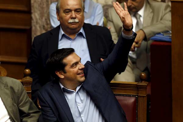 Greek PM wins parliament backing for bailout reforms package