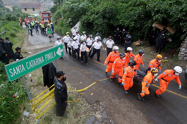 Families mourn victims of Guatemala landslide, hundreds feared dead