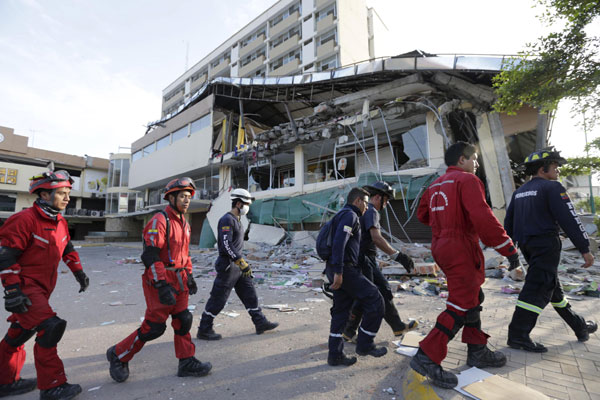 Ecuador counts over 400 quake deaths, damage in the billions