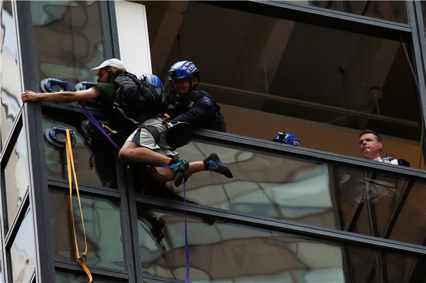 Man scaling Trump Tower in New York City pulled inside by police