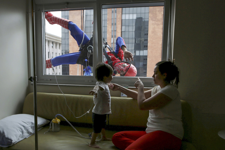 Superheroes make surprise visit to Brazil's children's hospital