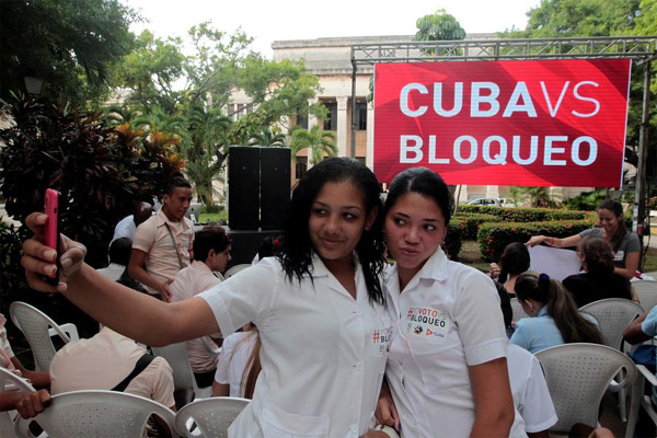UN adopts resolution urging end to Cuban embargo, US abstains for first time
