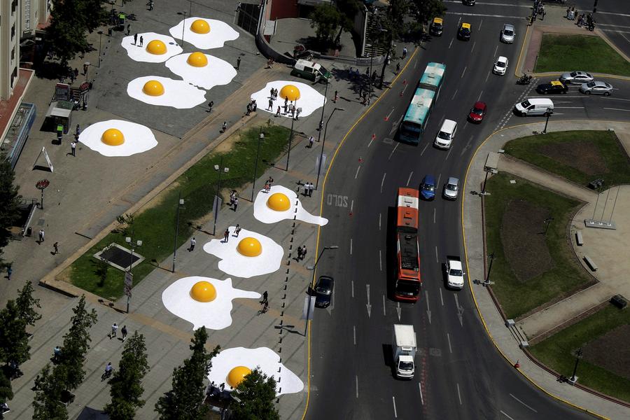 Streets are alive with giant fried eggs in Santiago