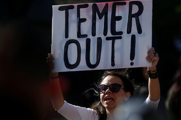 Bad news piles up for Temer as ally leaves government