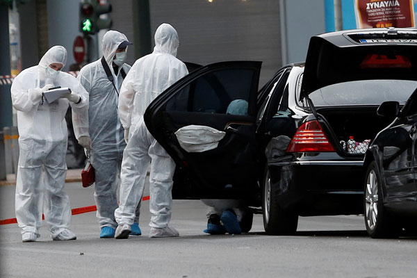 Former Greek PM Loukas Papademos lightly injured in booby trapped envelope blast