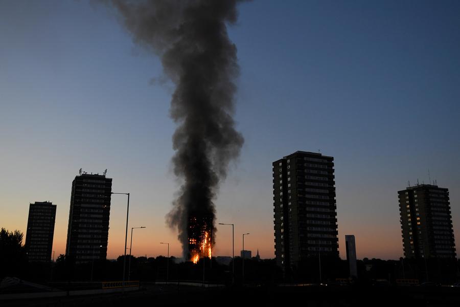 Fire engulfs London tower block, at least 12 dead