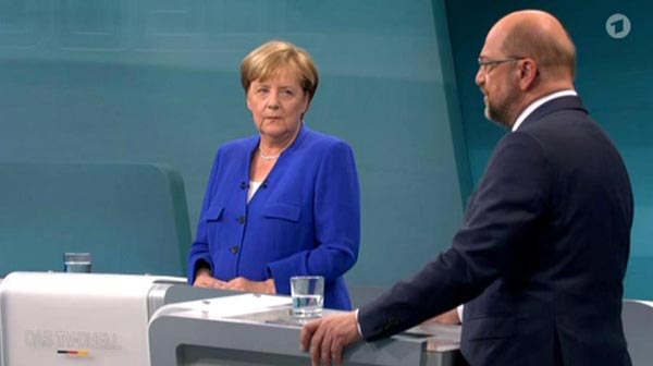 Merkel defends refugee policy as Schulz attacks in TV debate