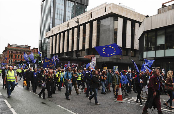 50,000 protesters gather in Manchester as May's Conservatives start their conference