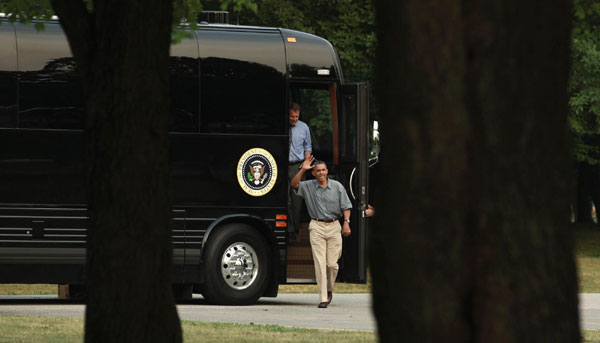 Obama touts record, attacks Romney on campaign bus tour