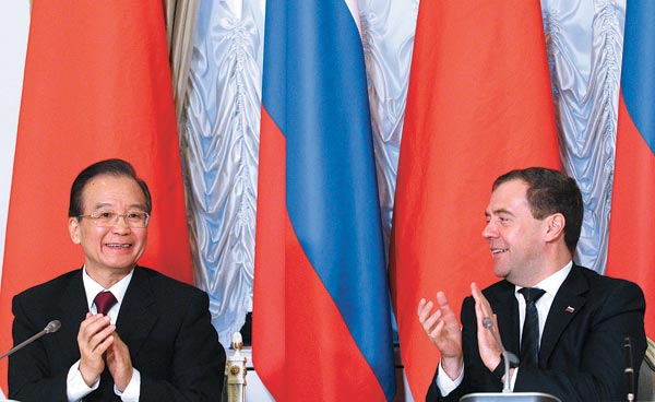 China inks energy and trade deals with Russia