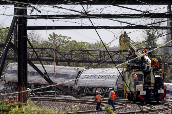 At least six die in Philadelphia train derailment, scores hurt