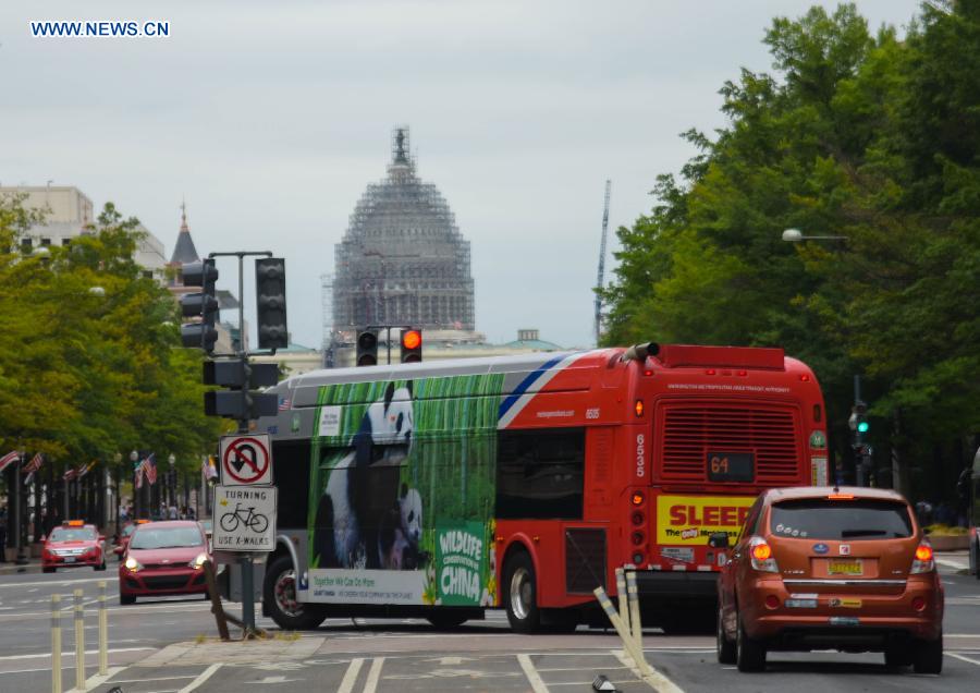 Buses with images of 6 endangered animals of China drive in US