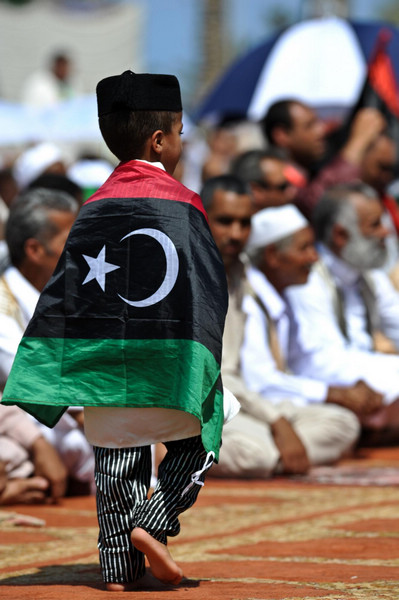 Libyan Muslims pray at Martyr's Square