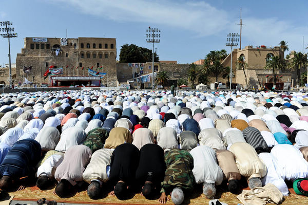 Libyan Muslims pray at Martyr's Square
