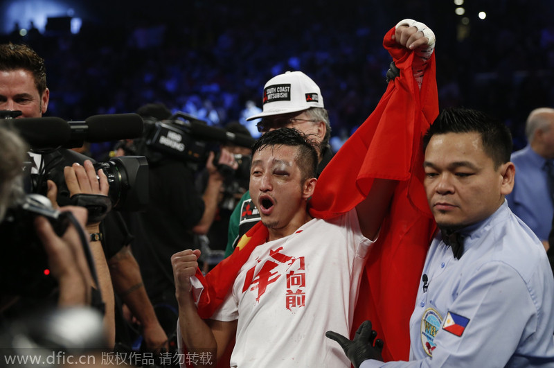 China's boxer Zou guaranteed shot at Amnat Ruenroeng in 2015