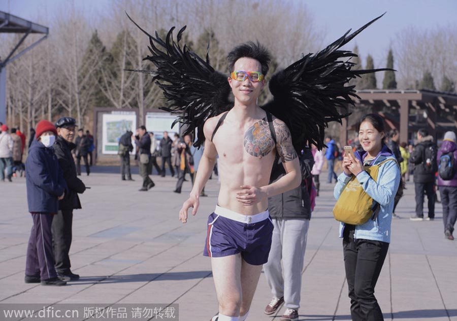 Monkey king, angel and superwoman at Beijing's 'naked run' race