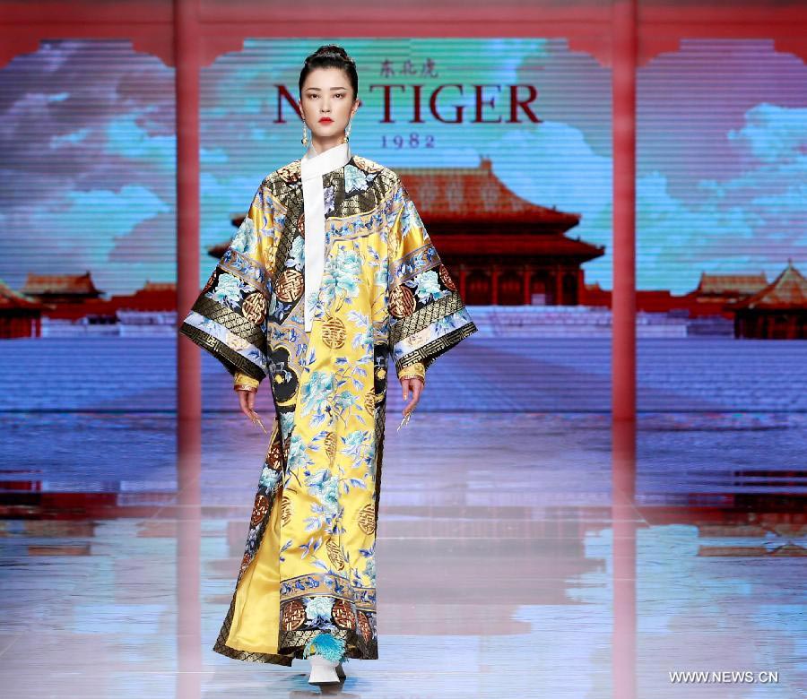 Qipaos sizzle on the runway as China Fashion Week kicks off