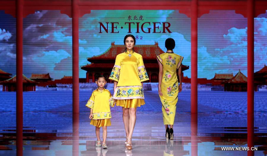 Qipaos sizzle on the runway as China Fashion Week kicks off