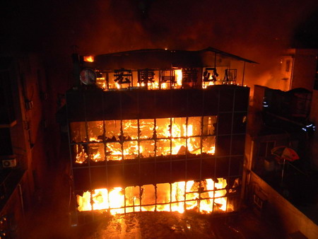 Death toll in building fire rises to nine