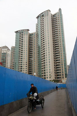 Policies, developers' cuts push housing prices down again