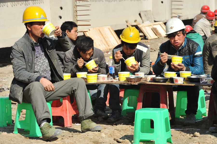 Cooking lunch for Chinese construction workers