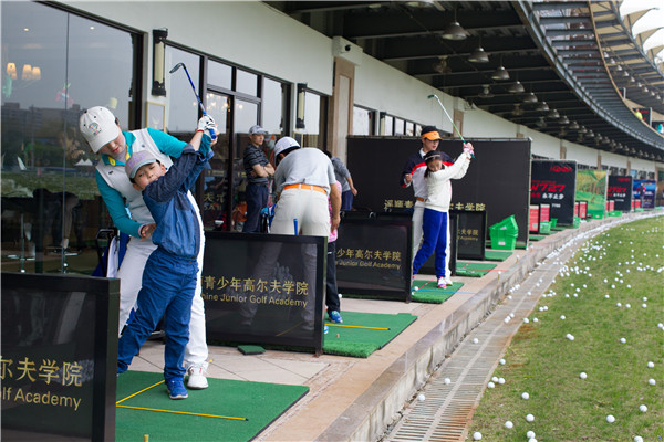 Young golfers enjoy the rub of the green