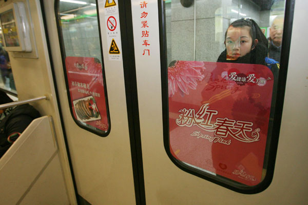Women ride the first pink subway