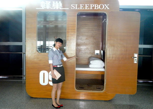 Sleepy travelers happy to be in sleeping box