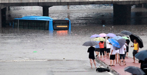 Beijing flood death toll hits 77