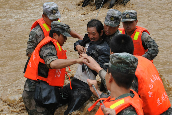 Six dead, 12 missing in landslides, floods