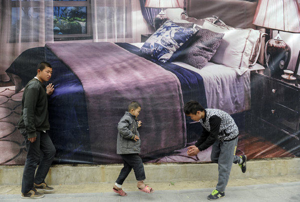 in front of poster advertising beds in shenyang, northeast