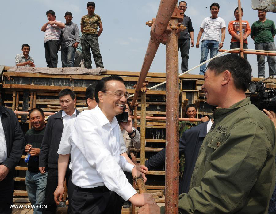 Premier Li urges sustainable development, better livelihood