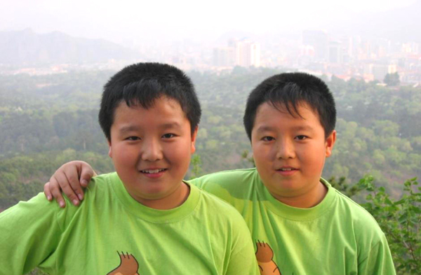 Trending: Chubby twins grow into handsome young scholars