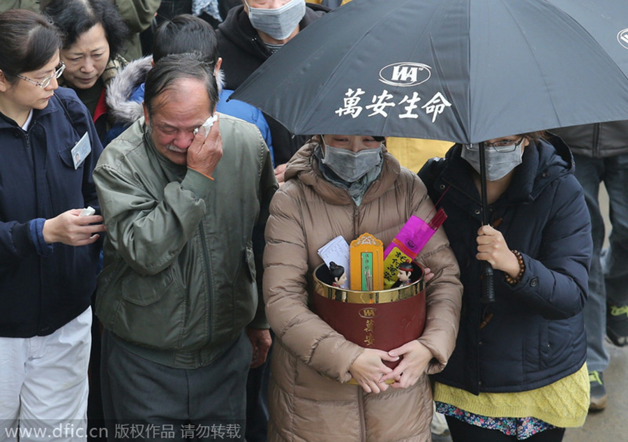 Family members mourn air crash victims