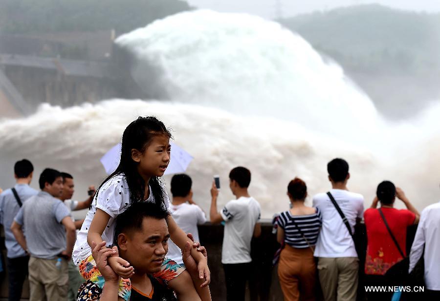 Tourists amazed by artificial water cascades in Henan