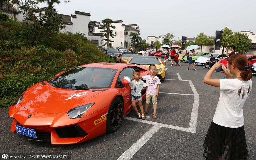 High-end sports cars rally in ancient town