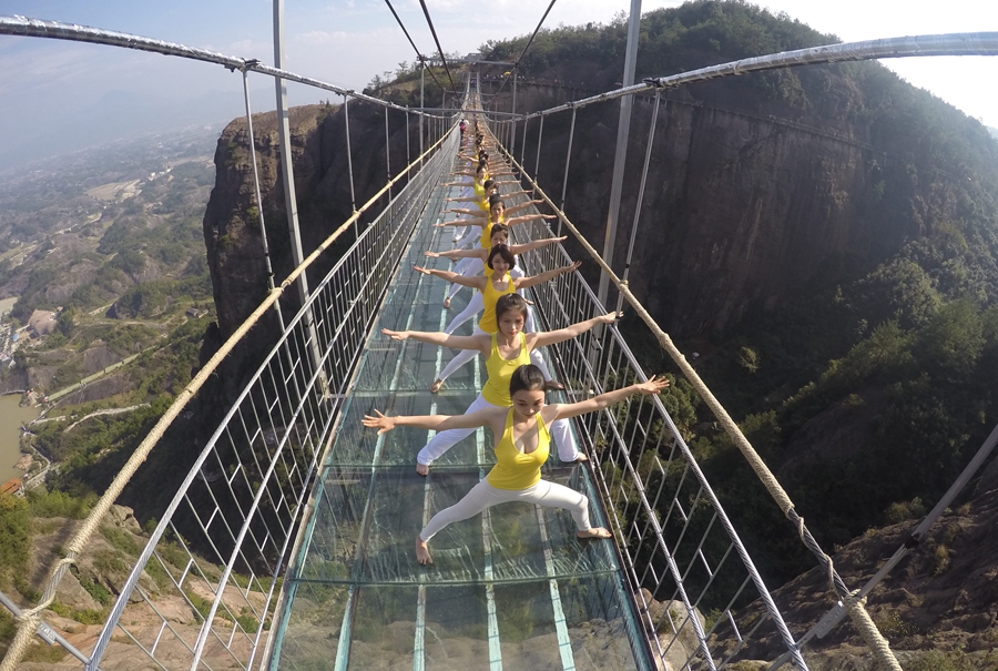 Yoga in the air on suspended bridge