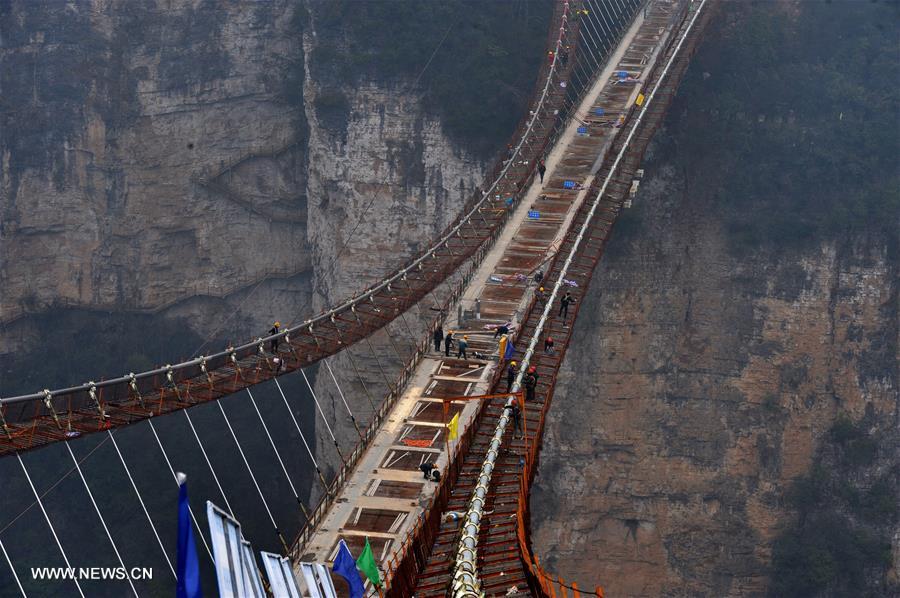 Glass bridge across Zhangjiajie Grand Canyon under construction